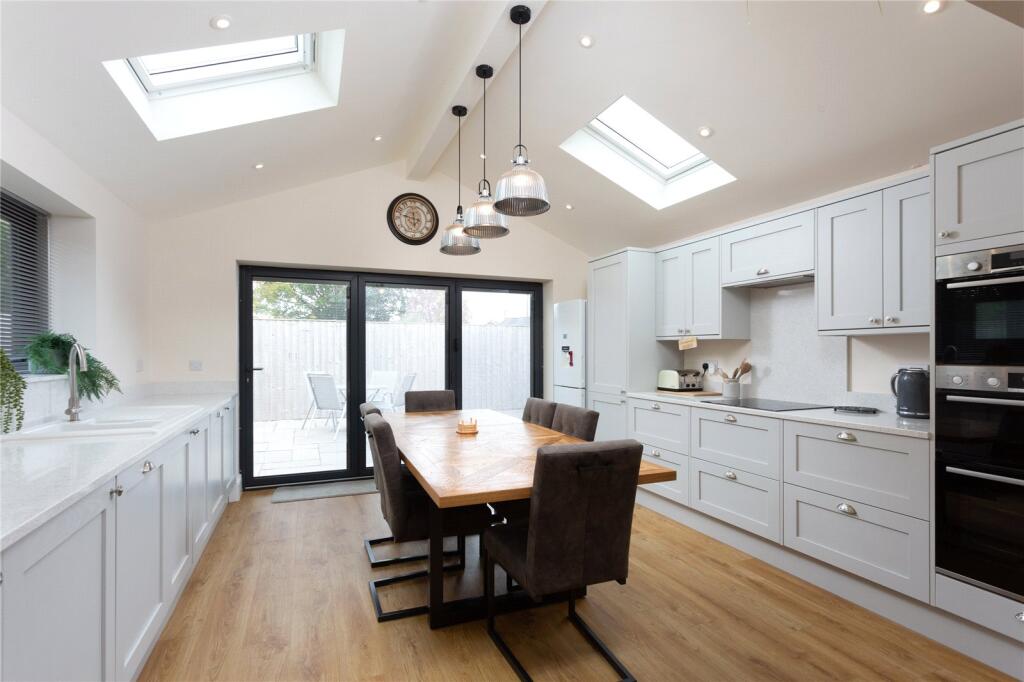 Howdens kitchen and dining area in the rear bungalow extension, with rooflights and glazed garden doors